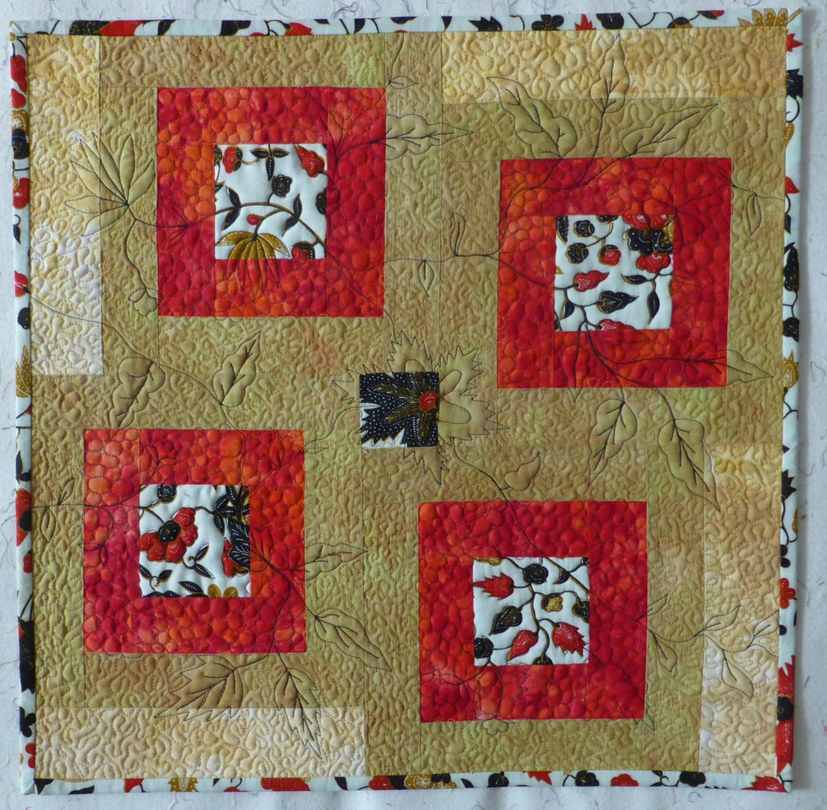 By Anne Maundrell. http://www.annemaundrelldesigns.com My version of the scrappy 20 x 20 made with some of my hand dyed fabrics left over from other projects and a bit of batik sarong fabric more than 20 years old. This was fun to do and a great opportunity to practice some free motion quilting too.